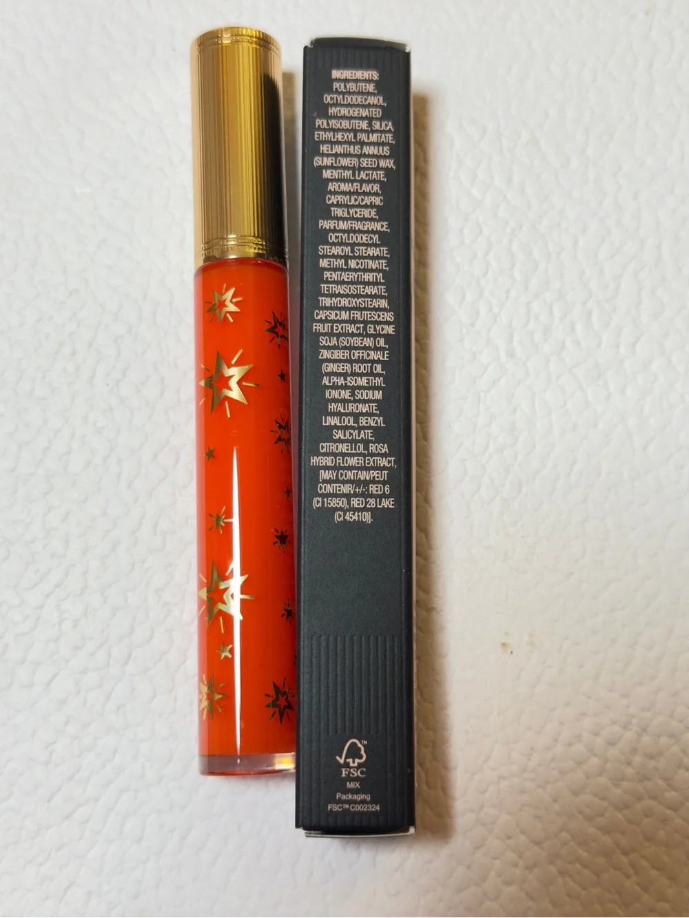 Gucci Orange-Red Lip Gloss with Gold Star Accents